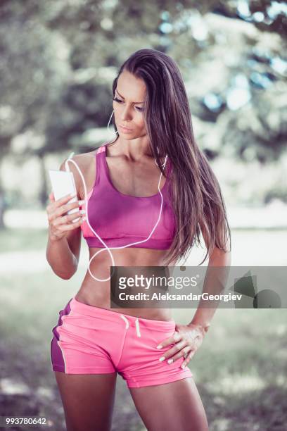 female athlete making a vlog about exercising in park - the soundtrack of my life stock pictures, royalty-free photos & images