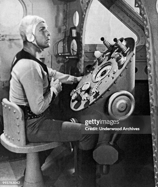 View of American actor Buster Crabbe , in costume as the title character in the serial 'Buck Rodgers' , Hollywood, California, 1939. The serial,...