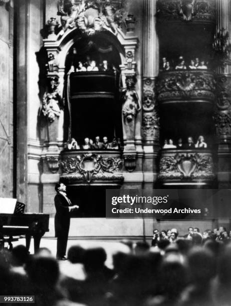 Italian opera singer tenor Tito Schipa , of the Chicago Civic Opera Company, performs onstage during a benefit concert at the Grand Opera de Paris,...