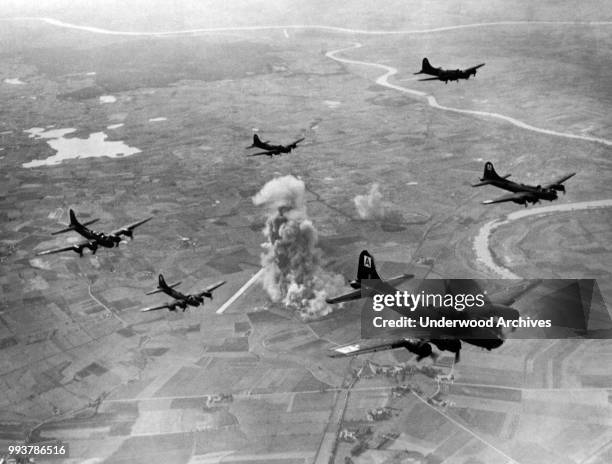 Aerial view of a squadron of American Boeing B-17 Flying Fortresses from the US 8th Air Force Bomber Command, as they fly away from a bombing run at...