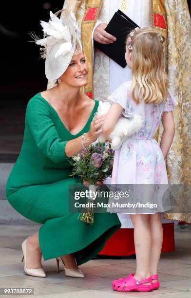 Sophie, Countess of Wessex receives a posy from Lola Gregory as she attends a service to celebrate the 70th Anniversary of the NHS at Westminster...