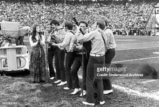 American folk and pop group the New Christy Minstrels perform on the field during the halftime show at Super Bowl IV in Tulane Stadium, New Orleans,...