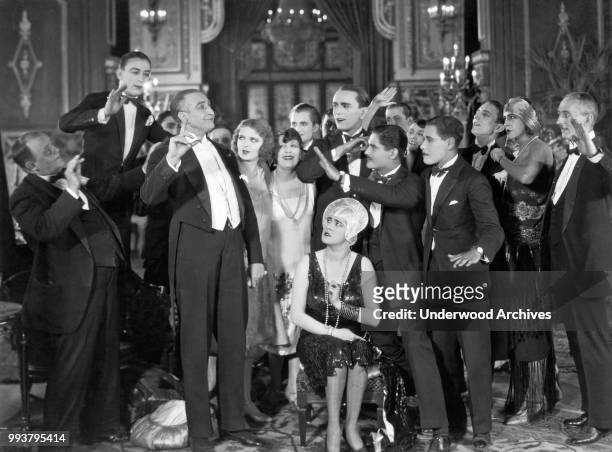 View of unidentified cast members in a scene from an unspecified film, Hollywood, California, circa 1923.