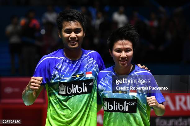 Gold medalist Tontowi Ahmad and Liliyana Natsir of Indonesia celebrate victory after beating Chan Peng Soon and Goh Liu Ying of Malaysia during the...