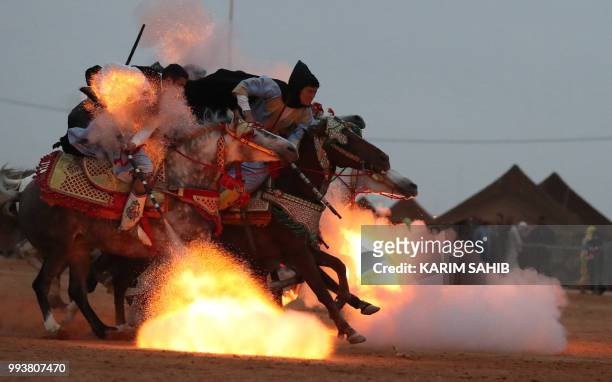 Horsemen ride in a choreographed cavalry charge in a fantasia during the 14th Tan-Tan Moussem Berber festival on July 8, 2018 in the western Moroccan...