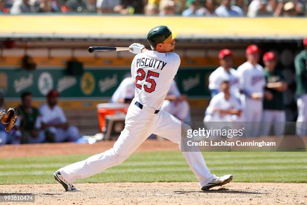 Stephen Piscotty of the Oakland Athletics hits a two-run double in the eighth inning against the San Diego Padres in at Oakland Alameda Coliseum on...