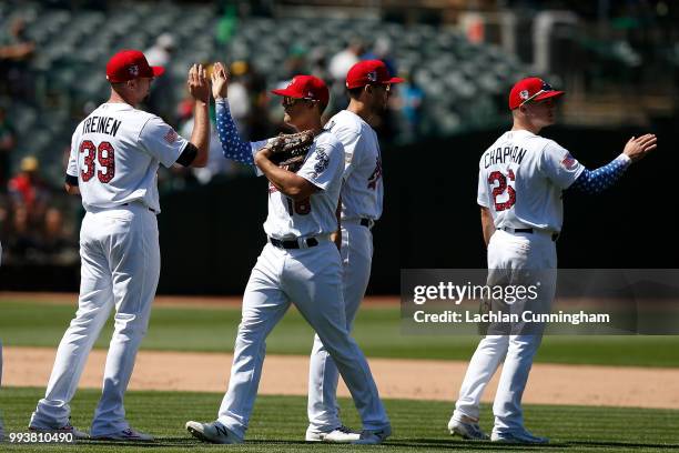 Oakland Athletics players Blake Treinen, Chad Pinder, Matt Olson and Matt Chapman celebrate after a win against the San Diego Padres at Oakland...