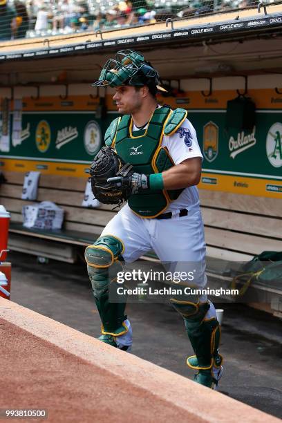 Josh Phegley of the Oakland Athletics leaves the dugout before the game against the San Diego Padres at Oakland Alameda Coliseum on July 4, 2018 in...