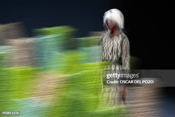 Model displays an outfits of Spanish designer Teresa Helbig Spring/Summer 2019 collection during the Madrid's Mercedes Benz Fashion Week on July 08,...