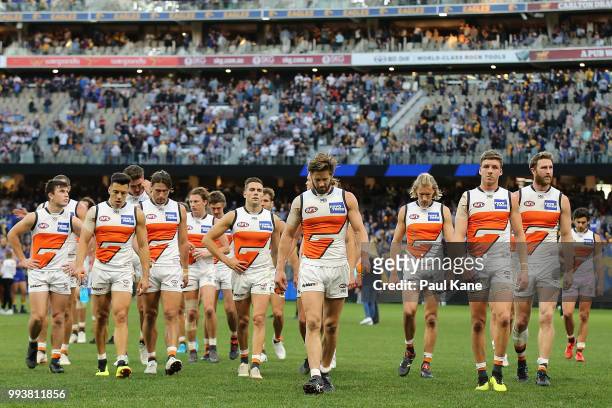 The Giants walk from the field after being defeated during the round 16 AFL match between the West Coast Eagles and the Greater Western Sydney Giants...