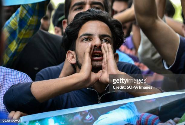 Kashmiri student shouts pro- freedom and anti- india slogans during a protest rally on the eve of the second death anniversary of the rebel commander...