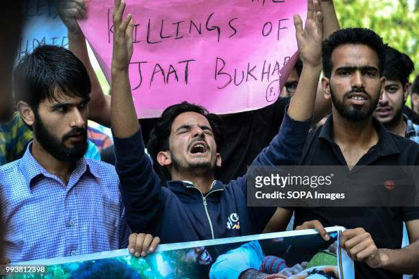 Kashmiri student shouts pro- freedom and anti- india slogans during a protest rally on the second death anniversary of the rebel commander Burhan...