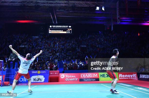 Winners Kevin Sanjaya Sukamuljo and Marcus Fernaldi Gideon of Indonesia celebrate their winning against Takuto Inoue and Yuki Kaneko of Japan during...