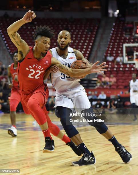 Garlon Green of the New Orleans Pelicans drives against Malachi Richardson of the Toronto Raptors during the 2018 NBA Summer League at the Thomas &...