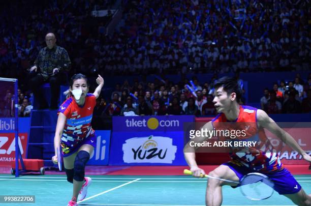 Chan Peng Soon and Goh Liu Ying of Malaysia play a return against Tontowi Ahmad and Liliyana Natsir of Indonesia during the mix's doubles badminton...