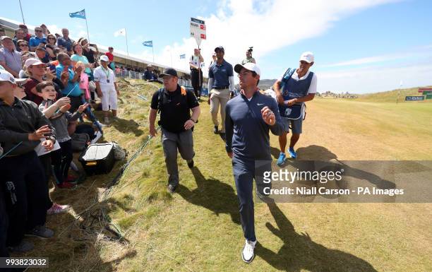 England's Aaron Rai and Northern Ireland's Rory McIlroy walk off the 18th during day four of the Dubai Duty Free Irish Open at Ballyliffin Golf Club.
