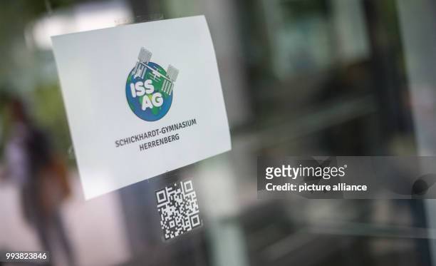 July 2018, Herrenberg, Germany: A sign reading "ISS AG" can be seen at the Schickhardt secondary school during a skype session with ESA astronaut...