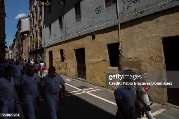 Revellers walk the streets in the old town on the third day of the San Fermin Running of the Bulls festival on July 8, 2018 in Pamplona, Spain. The...