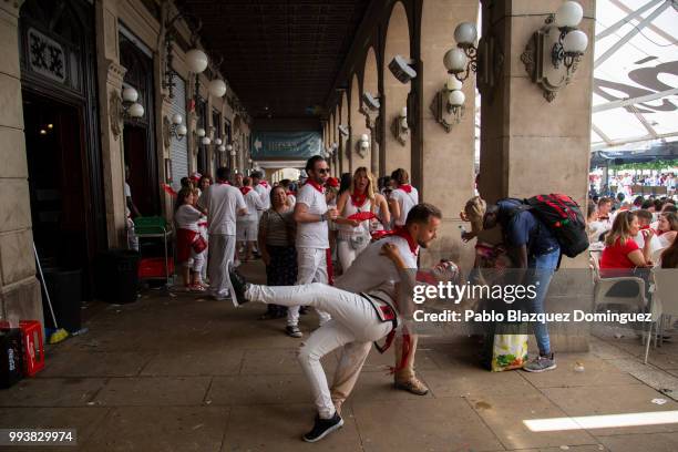 Revellers dance on the third day of the San Fermin Running of the Bulls festival on July 8, 2018 in Pamplona, Spain. The annual Fiesta de San Fermin,...