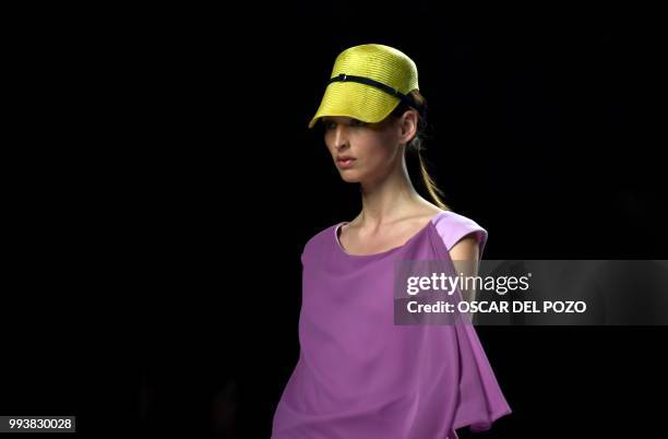 Model displays an outfit of Spanish designer Ulises Merida Spring/Summer 2019 collection during the Madrid's Mercedes Benz Fashion Week on July 08,...