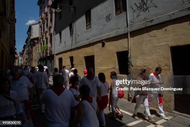 Revellers walk the streets in the old town on the third day of the San Fermin Running of the Bulls festival on July 8, 2018 in Pamplona, Spain. The...