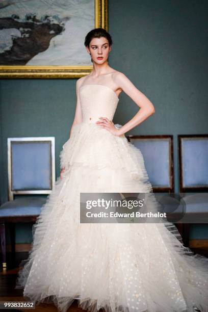 Model wears a white lace dress, after the Ulyana Sergeenko Haute Couture Fall Winter 2018/2019 show as part of Paris Fashion Week on July 3, 2018 in...