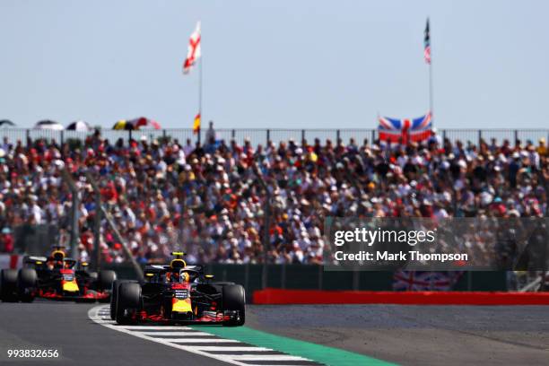 Max Verstappen of the Netherlands driving the Aston Martin Red Bull Racing RB14 TAG Heuer leads Daniel Ricciardo of Australia driving the Aston...