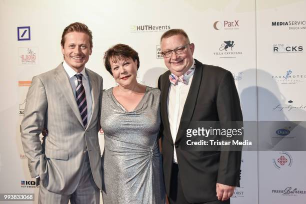German actor Roman Knizka, Marina Reimer and her husband Lutz Reimer during the Aline Reimer Foundation Gala on July 7, 2018 in Berlin, Germany.