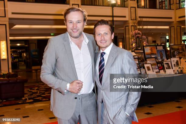 Stephan Grossmann and German actor Roman Knizka during the Aline Reimer Foundation Gala on July 7, 2018 in Berlin, Germany.
