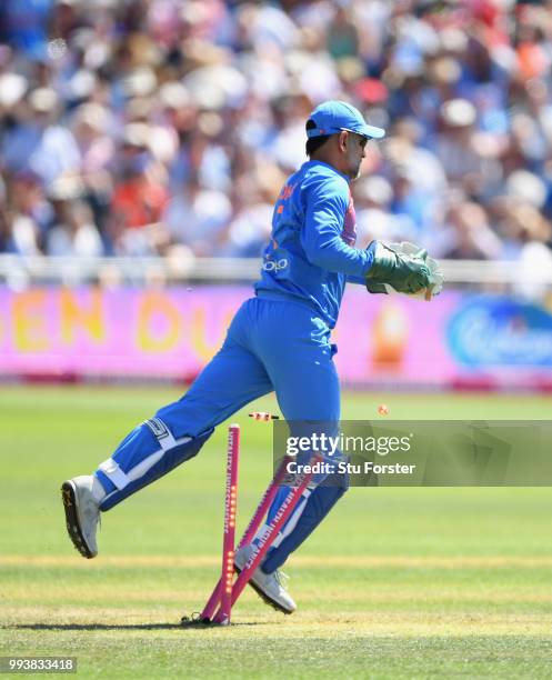 India wicketkeeper MS Dhoni catches out Eoin Morgan before treading onto the stumps during the 3rd Vitality International T20 match between England...