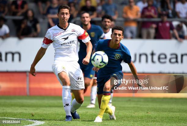 Nathan Holland of West Ham tackles Remo Arnold of Winterthur during the preseason friendly between FC Winterthur and West Ham United on July 8, 2018...