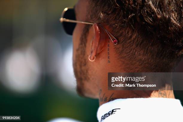 Lewis Hamilton of Great Britain and Mercedes GP looks on on the grid before the Formula One Grand Prix of Great Britain at Silverstone on July 8,...