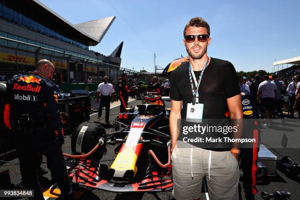 Manchester United coach and former player Michael Carrick poses for a photo with Red Bull Racing on the grid before the Formula One Grand Prix of...