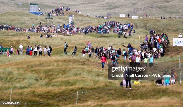 Fans follow Northern Ireland's Rory McIlroy during day four of the Dubai Duty Free Irish Open at Ballyliffin Golf Club.