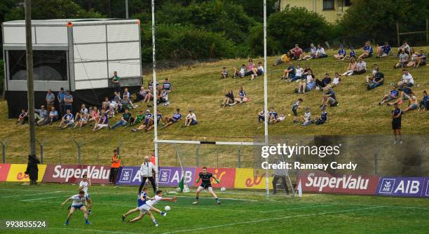 Navan , Ireland - 8 July 2018; Paul Kingston of Laois shoots to score his side's first goal of the game despite the attention of Kieran Duffy of...