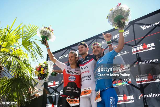 Second place Patrik Nilsson of Sweden, first place Jan Frodeno of Germany and third place Patrik Lange of Germany celebrate after the Mainova IRONMAN...