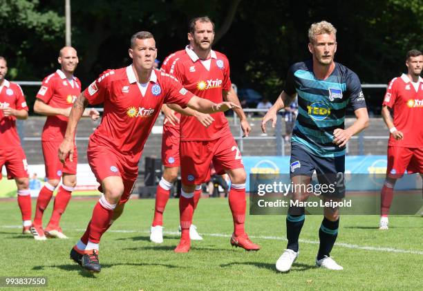 Stanislav Iljutcenko, Sebastian Neumann of MSV Duisburg and Fabian Lustenberger of Hertha BSC before the game between Hertha BSC against MSV Duisburg...