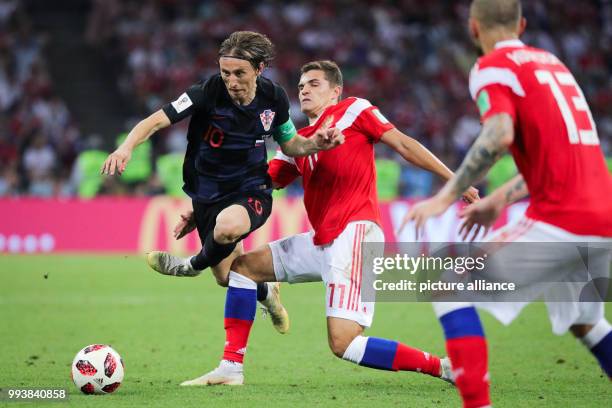 July 2018, Russia, Sotchi: Soccer: FIFA World Cup, Quarter Final: Russia vs Croatia Sotchi stadium. Luka Modric from Croatia in action against Roman...