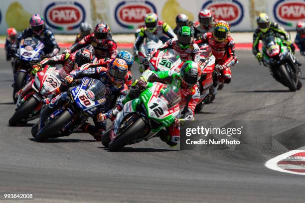 Xavi Fores of Barni Racing Team come before Michael Van Der Mark of Pata Yamaha Official WorldSBK Team during the first lap of race 2 of the Motul...