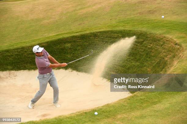 Ryan Fox of New Zealand hits from a bunker on the 14th hole during the final round of the Dubai Duty Free Irish Open at Ballyliffin Golf Club on July...