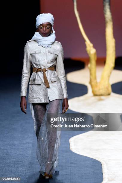 Model walks the runway at the Miguel Marinero show during the Mercedes-Benz Fashion Week Madrid Spring/Summer 2019 at IFEMA on July 8, 2018 in...