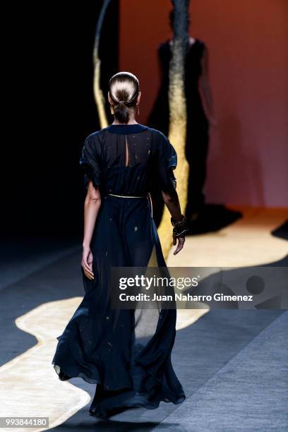 Model walks the runway at the Miguel Marinero show during the Mercedes-Benz Fashion Week Madrid Spring/Summer 2019 at IFEMA on July 8, 2018 in...