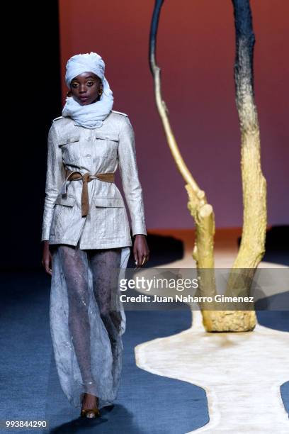 Model walks the runway at the Miguel Marinero show during the Mercedes-Benz Fashion Week Madrid Spring/Summer 2019 at IFEMA on July 8, 2018 in...