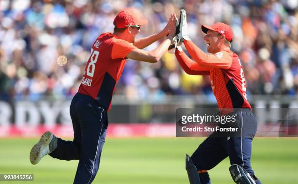 England fielder Jake Ball celebrates with Jos Buttler after catching Dhawan during the 3rd Vitality International T20 match between England and India...