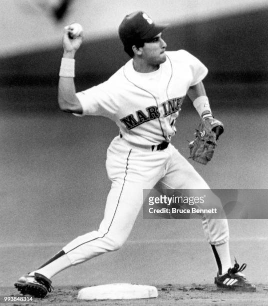 Omar Vizquel of the Seattle Mariners throws the ball to first during an MLB game circa 1990 at the Kingdome in Seattle, Washington.