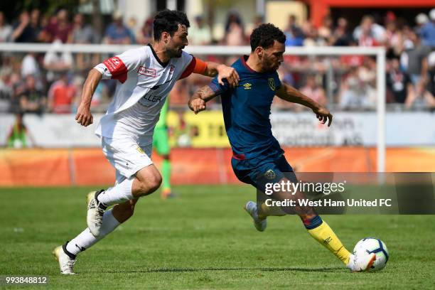 Ryan Fredericks tackles Luca Radice of FC Winterthur during the preseason friendly between FC Winterthur and West Ham United on July 8, 2018 in...