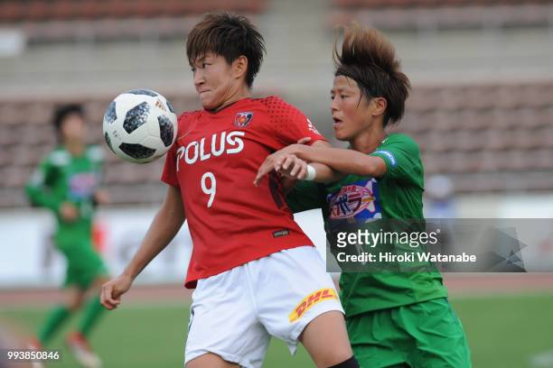 Yuika Sugasawa of Urawa Red Diamonds and Saori Ariyoshi of NTV Beleza compete for the ball during the Nadeshiko League Cup Group A match between...