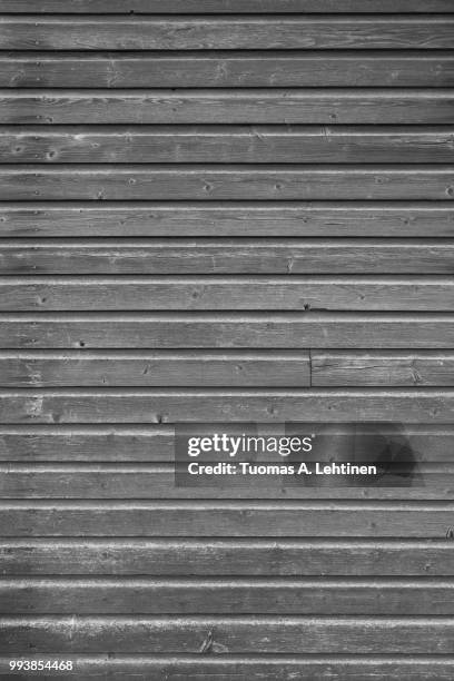 full frame background of an old and faded wood board wall in black and white - wood frame ストックフォトと画像