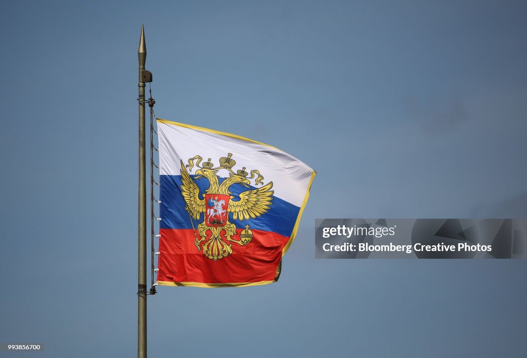 The Russian Coat Of Arms Sits On A Russian Flag Flying On The Roof Of The  Kremlin High-Res Stock Photo - Getty Images