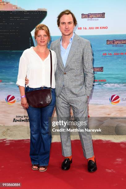 Joerdis Triebel and Lars Eidinger attend the 'Hotel Transsilvanien 3' premiere at CineStar on July 8, 2018 in Berlin, Germany.